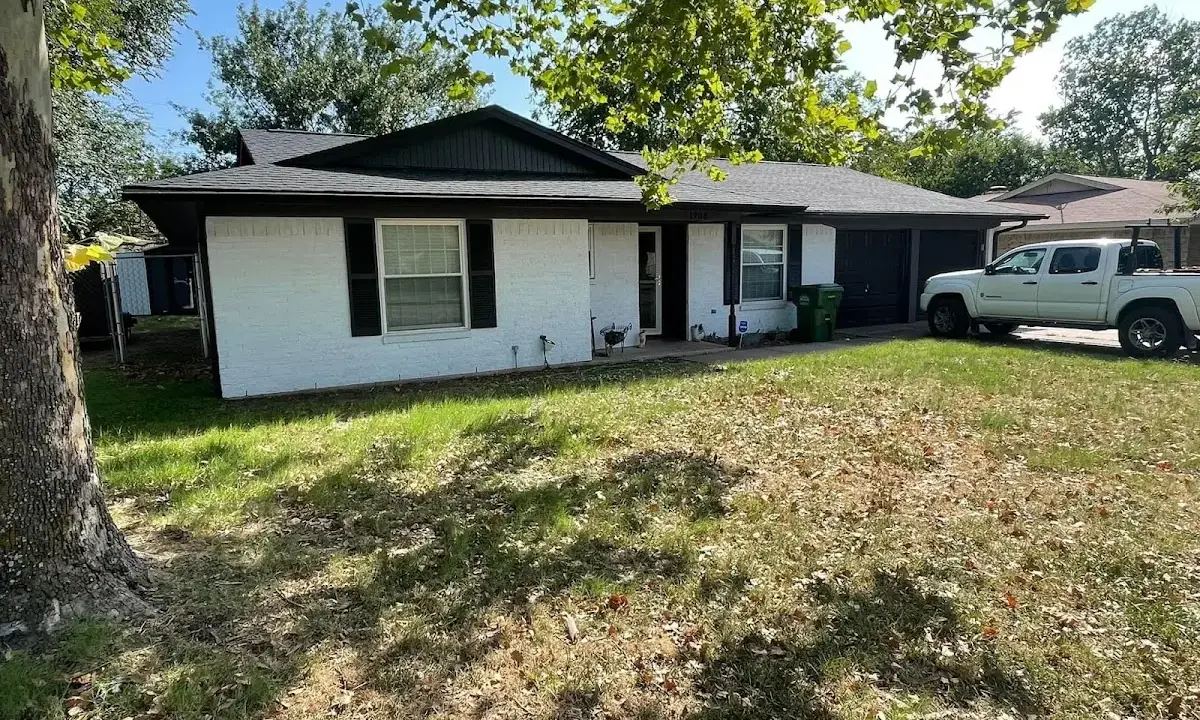 Professional roofing crew working on a residential roof in Pequannock